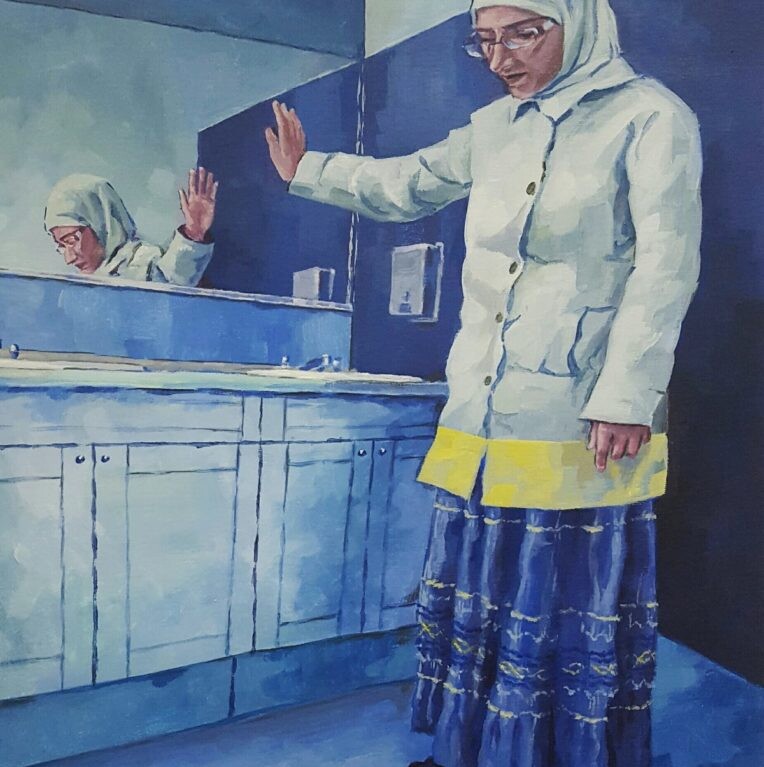 A woman in a white headscarf and long skirt stands in a blue-toned bathroom. She looks at a red book on the floor, extending one hand toward a mirror that reflects her. This scene subtly mirrors themes often explored in diversity programs, embracing self-awareness and reflection.