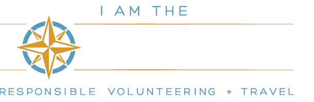 Logo with the text "I am the Voluntourist" and "responsible volunteering + travel." A compass graphic is incorporated into the word "Voluntourist," symbolizing exploration of diverse cultures, much like those celebrated in diversity programs.