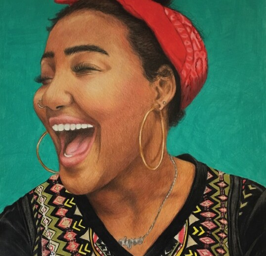 A woman with a bright smile and eyes closed is wearing a red headband and hoop earrings. Her patterned shirt, reminiscent of the diverse patterns emphasized in diversity programs, features geometric designs. A silver necklace glimmers against the green background, celebrating individuality.