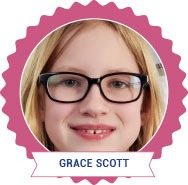 A child with glasses smiles at the camera, embodying the warmth of social emotional learning curriculum. The image is framed with a pink scalloped border, and a white banner at the bottom includes the name "Grace Scott.