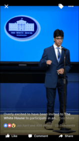 A person in a navy suit and striped tie stands on stage at a podium with a microphone, discussing the integration of SEL activities. The blue background behind them features the White House emblem, emphasizing the importance of social emotional learning in education policy.