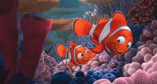 Illustration of two clownfish in an underwater coral reef, where the smaller fish follows and looks up at the larger one. The scene is colorful with various corals and soft lighting, evoking a sense of connection akin to social emotional learning activities.