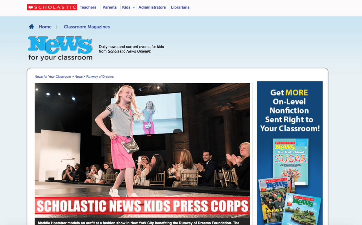 A young girl models a pink dress on a runway, captivating smiling spectators. The event, highlighting the social emotional learning curriculum, is part of a press feature for Scholastic News Kids Press Corps. Various magazine covers appear on the right side of the image.