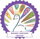 A colorful drawing of a peacock with multicolored feathers adorns the badge's purple border, symbolizing the essence of an SEL curriculum. Below it, a banner proudly reads "SHANIA HURTADO 'ROOT$'", reflecting its dedication to social emotional learning.
